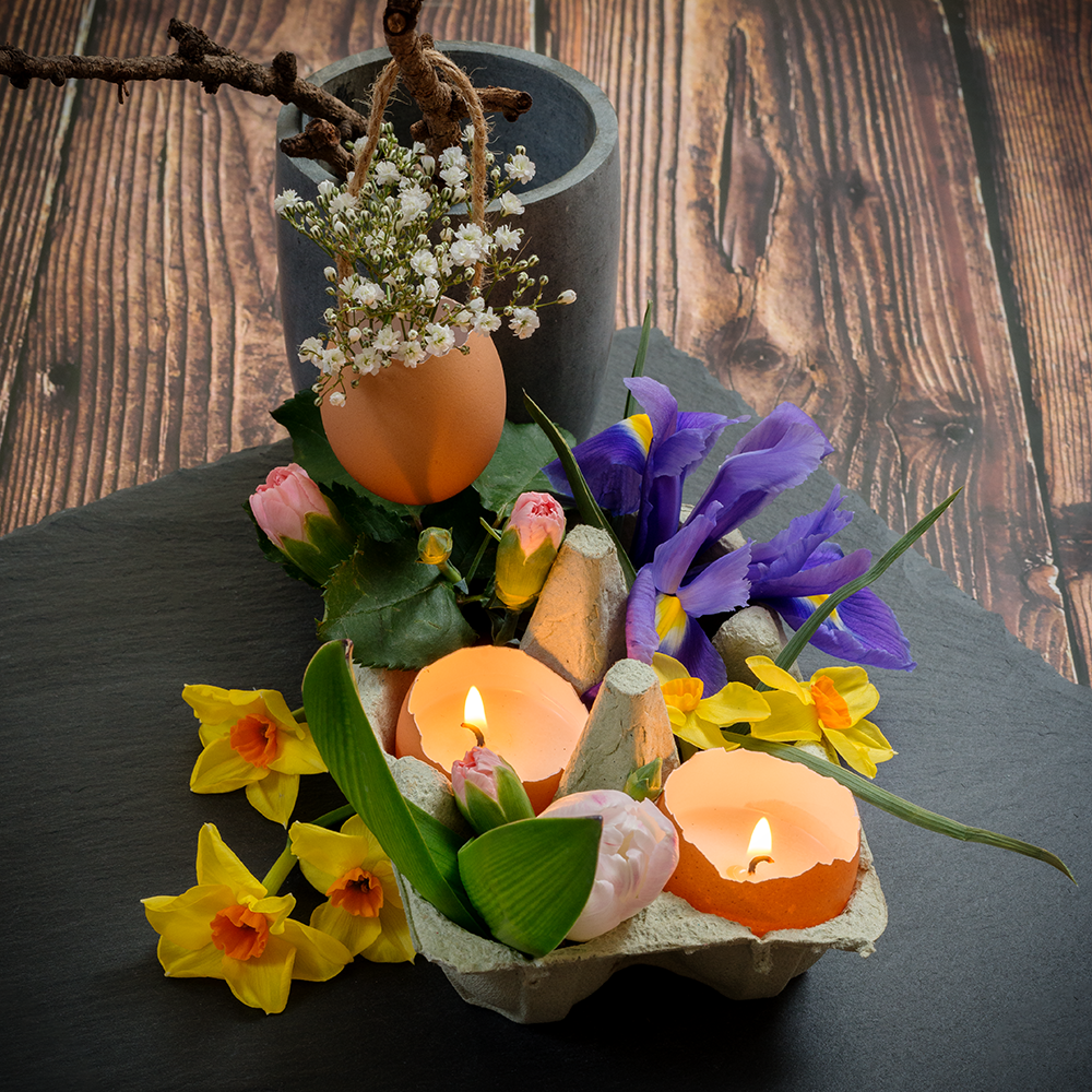 natural homemade easter table decoration spring floral centrepiece arrangement with egg candles and egg basket tutorial